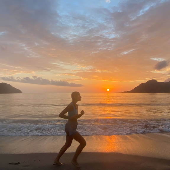 Plakias Resort Rethymno Crete Beach woman running sunset