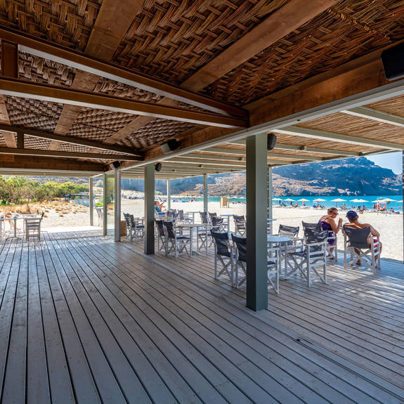 Plakias Resort Rethymno beach bar with tables and sandy beach