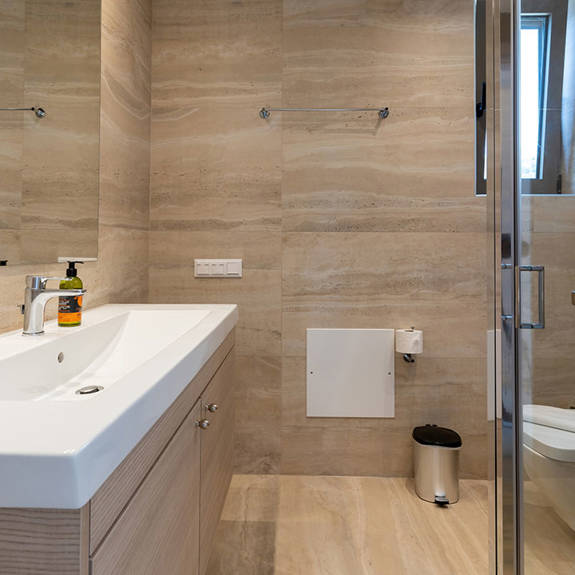 bathroom with shower and big washbasin in a two bedrooms maisonette in plakias, rethymno, crete