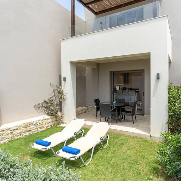 garden with lawn and sunbeds in a two bedrooms maisonette in plakias, rethymno, crete