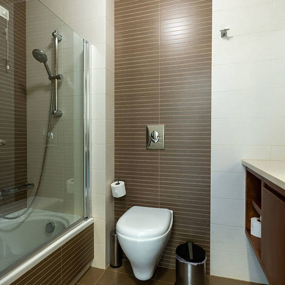 bathroom with bathtub and shower in a two bedrooms apartment in plakias, rethymno, crete