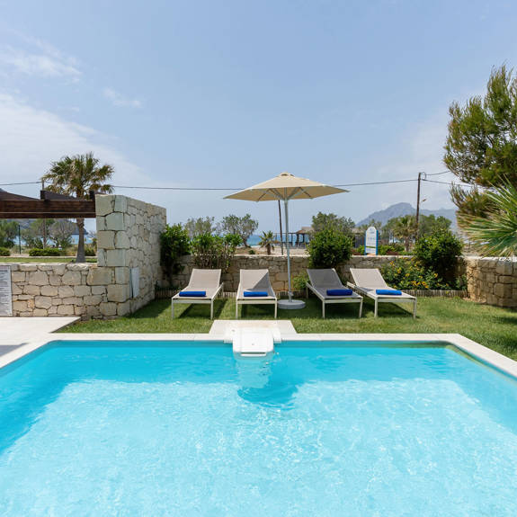 swimming pool with sunbeds and garden in a three bedrooms villa with pool and sea view in plakias, rethymno, crete