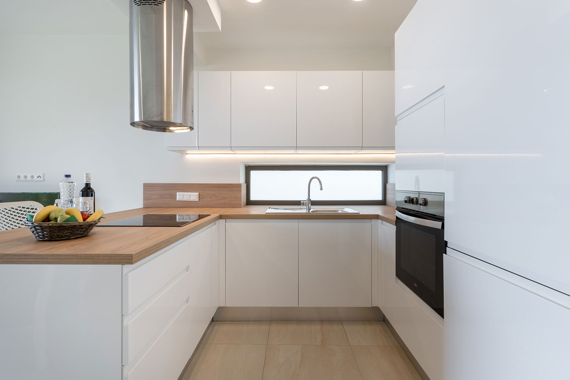 white, modern kitchen in a two bedrooms maisonette in plakias, rethymno, crete