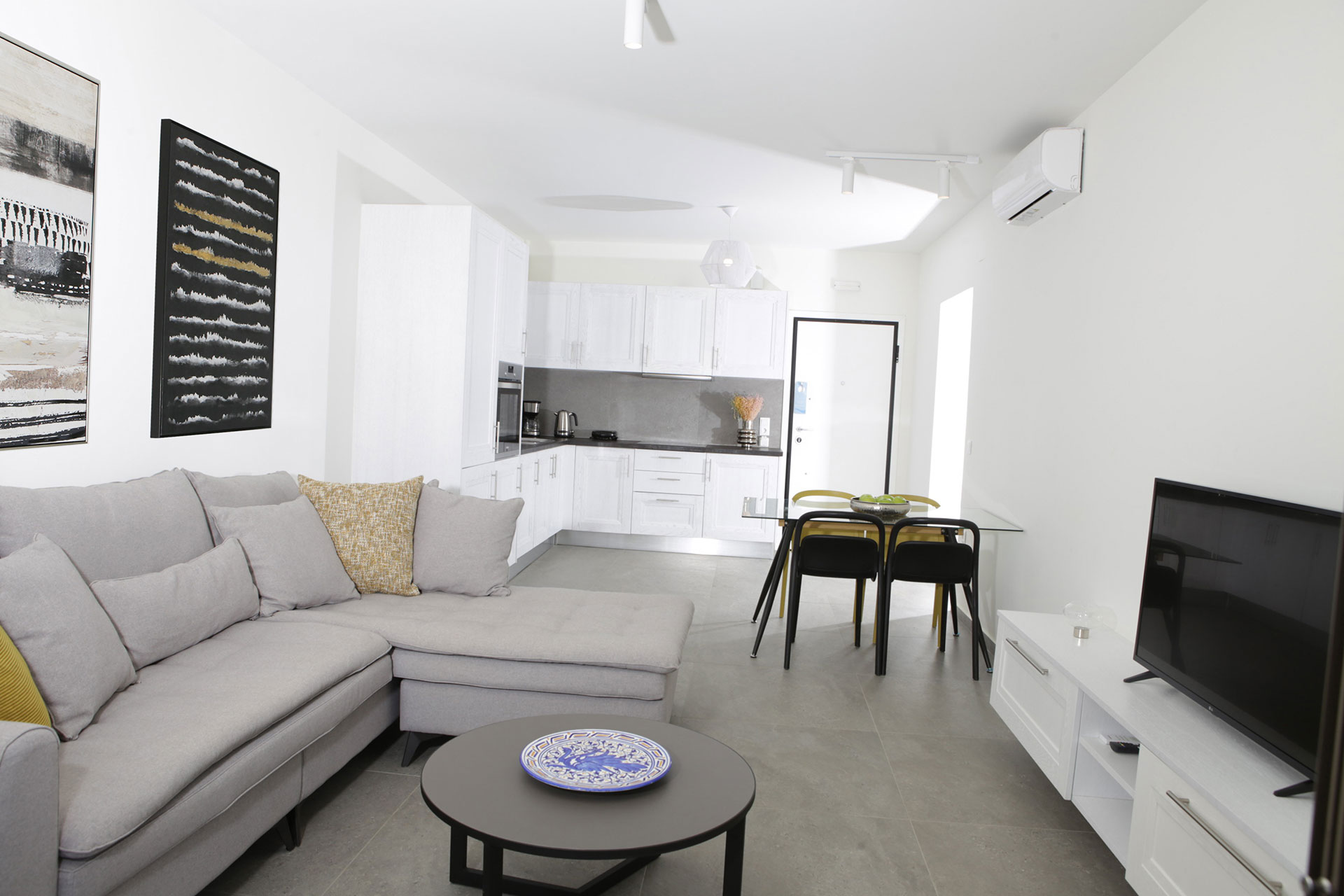 large kitchen area and modern living room in a two bedrooms superior apartment in plakias, rethymno, crete