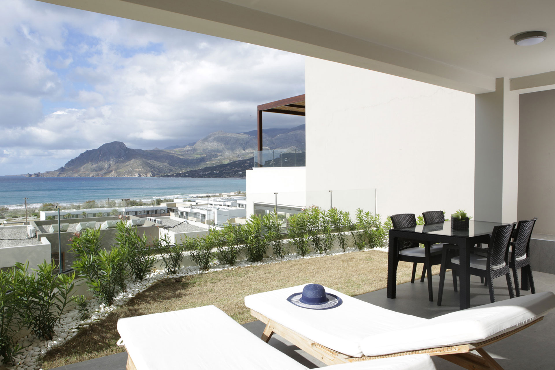 terrace with sunbeds and sea view in a two bedrooms superior apartment in plakias, rethymno, crete