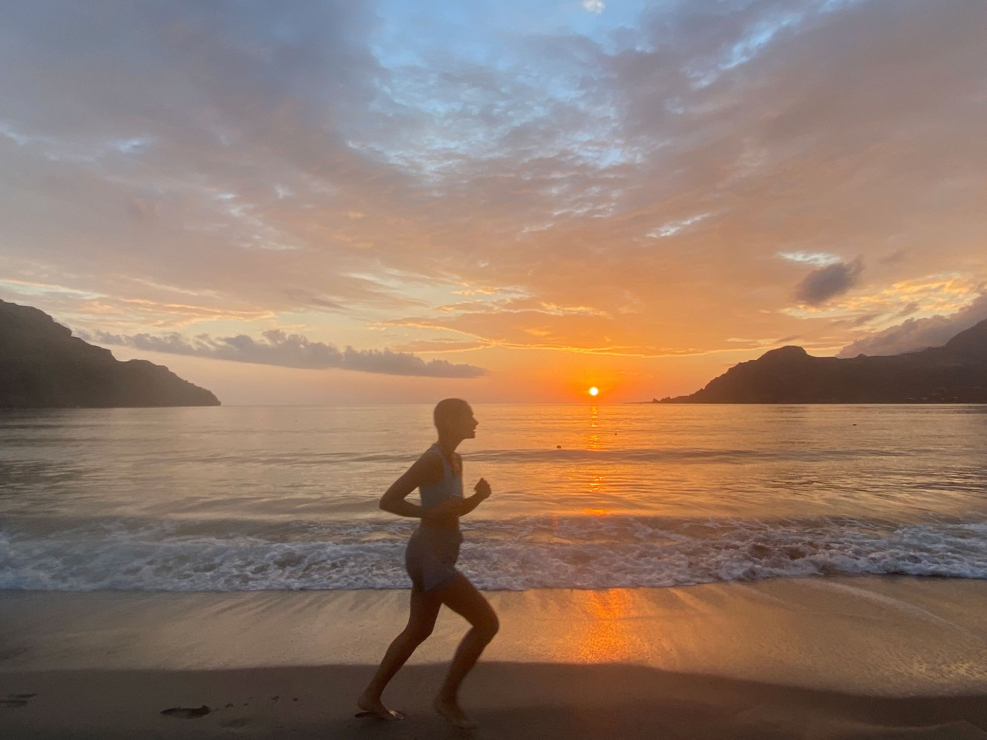 Plakias Resort Rethymno Crete Beach woman running sunset