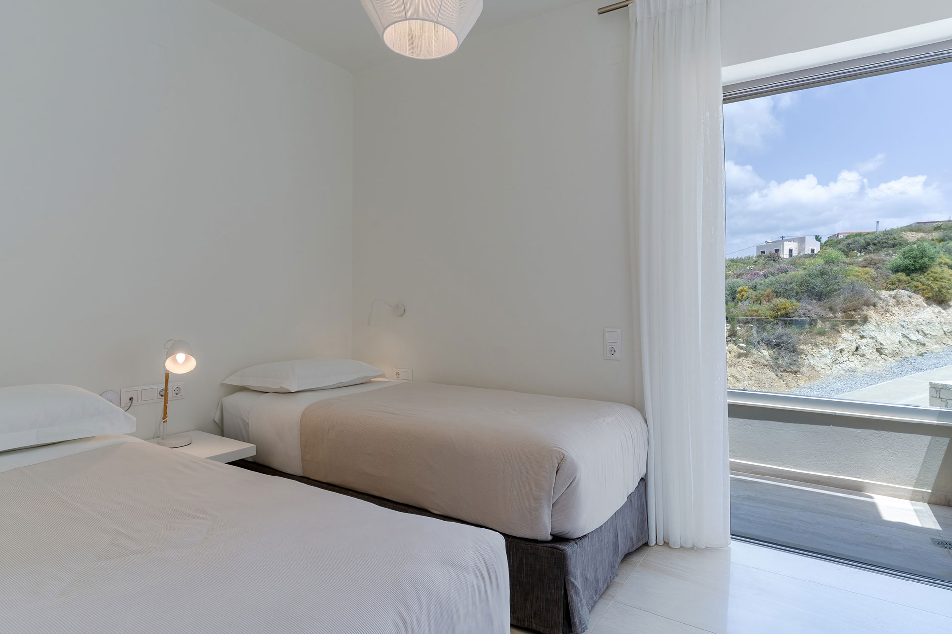 two single beds bedroom with mountain view in a two bedrooms maisonette in plakias, rethymno, crete