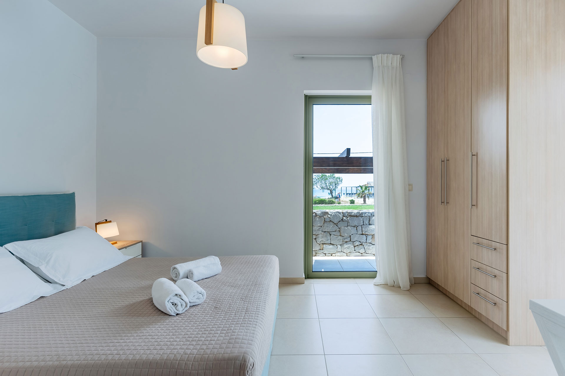 big bedroom with double bed and closet in a three bedrooms villa with sea view in plakias, rethymno, crete