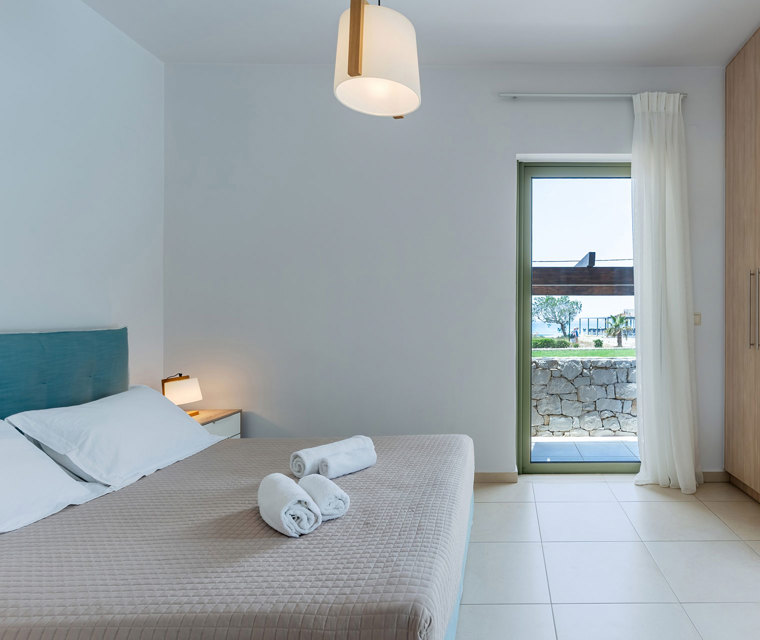 big bedroom with double bed and closet in a three bedrooms villa with sea view in plakias, rethymno, crete