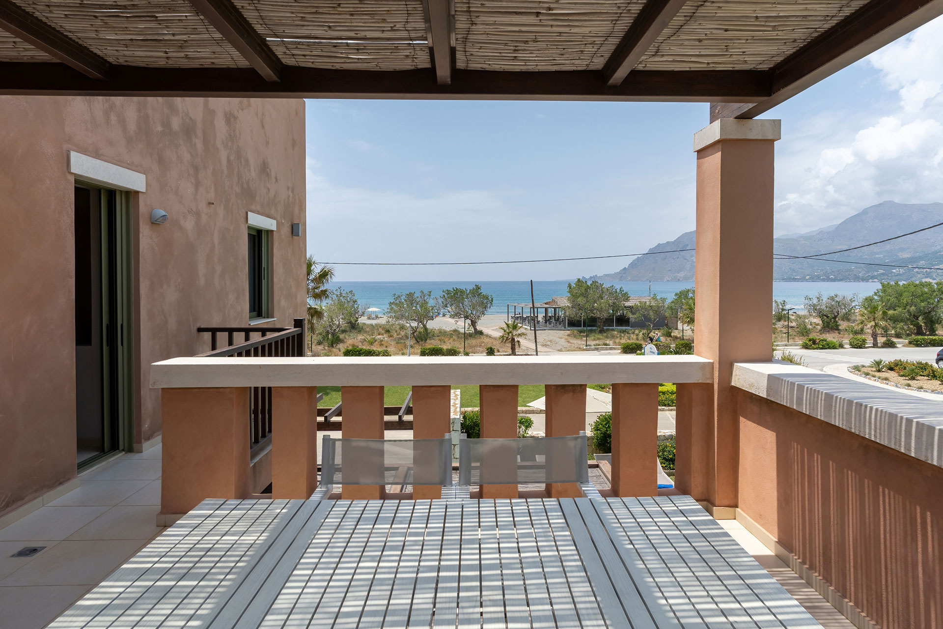 balcony with cane canopy in a three bedrooms villa with sea view in plakias, rethymno, crete