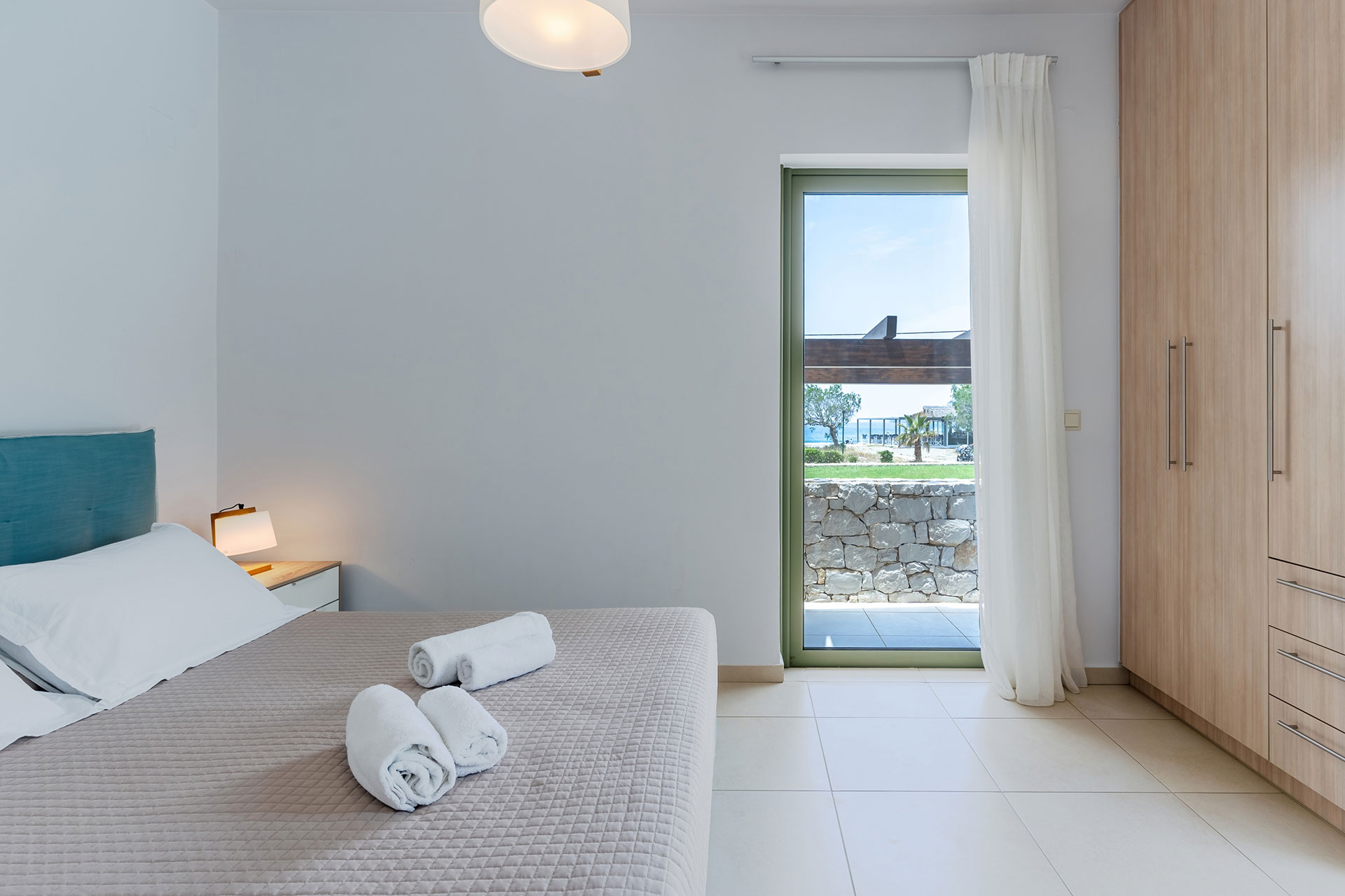 bedroom with double bed and closet in a three bedrooms villa with sea view in plakias, rethymno, crete