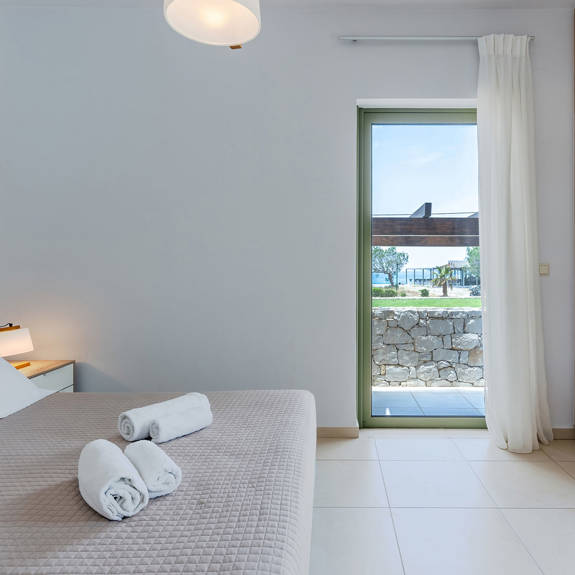 bedroom with double bed and closet in a three bedrooms villa with sea view in plakias, rethymno, crete