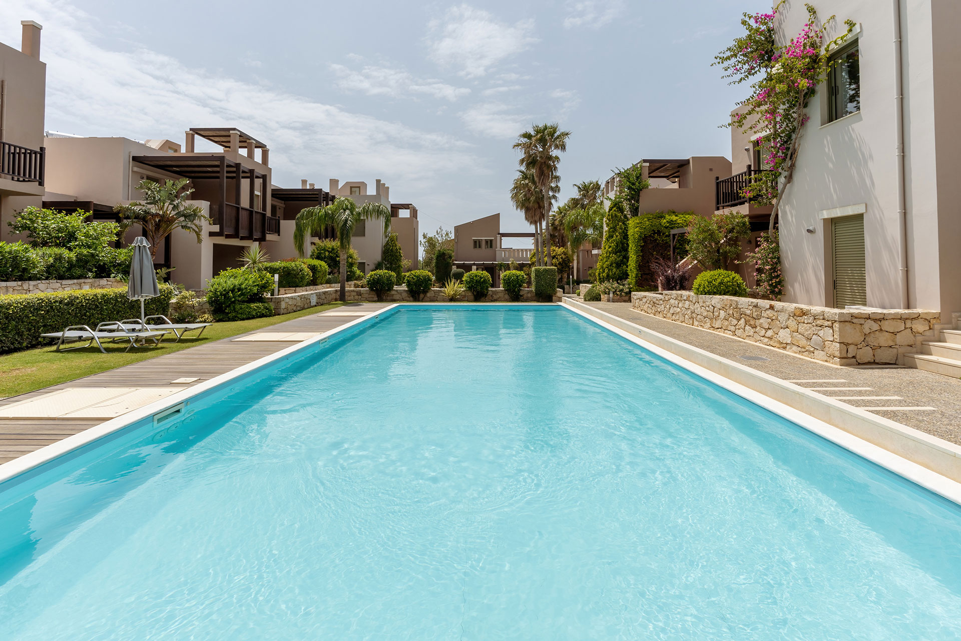 large swimming pool with sunbeds in plakias resorts in rethymno crete