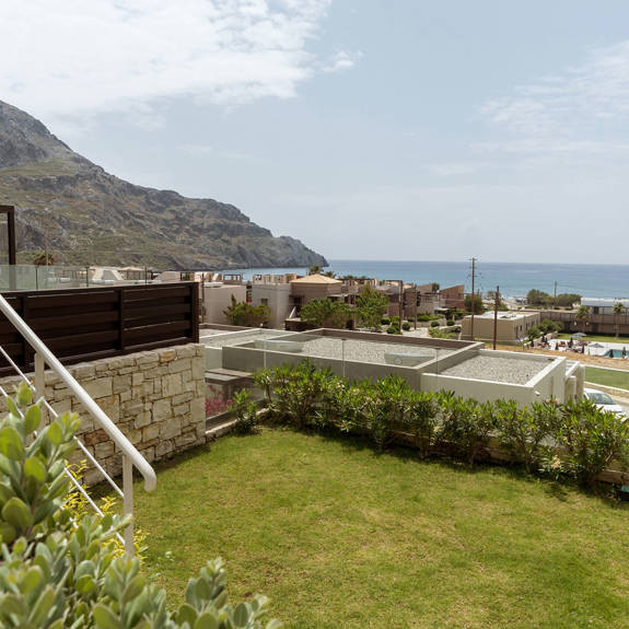 garden with lawn and pool and sea view in a two bedrooms maisonette in plakias, rethymno, crete