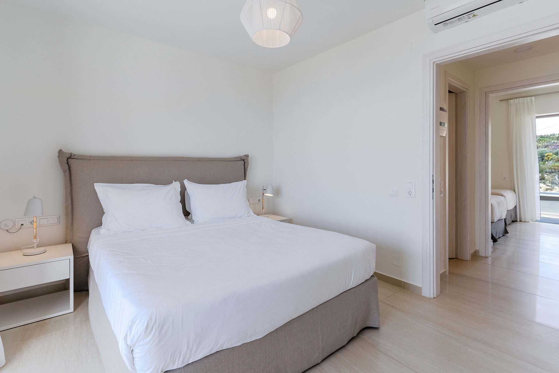 double bed bedroom and bedroom with two single beds in a two bedrooms maisonette in plakias, rethymno, crete