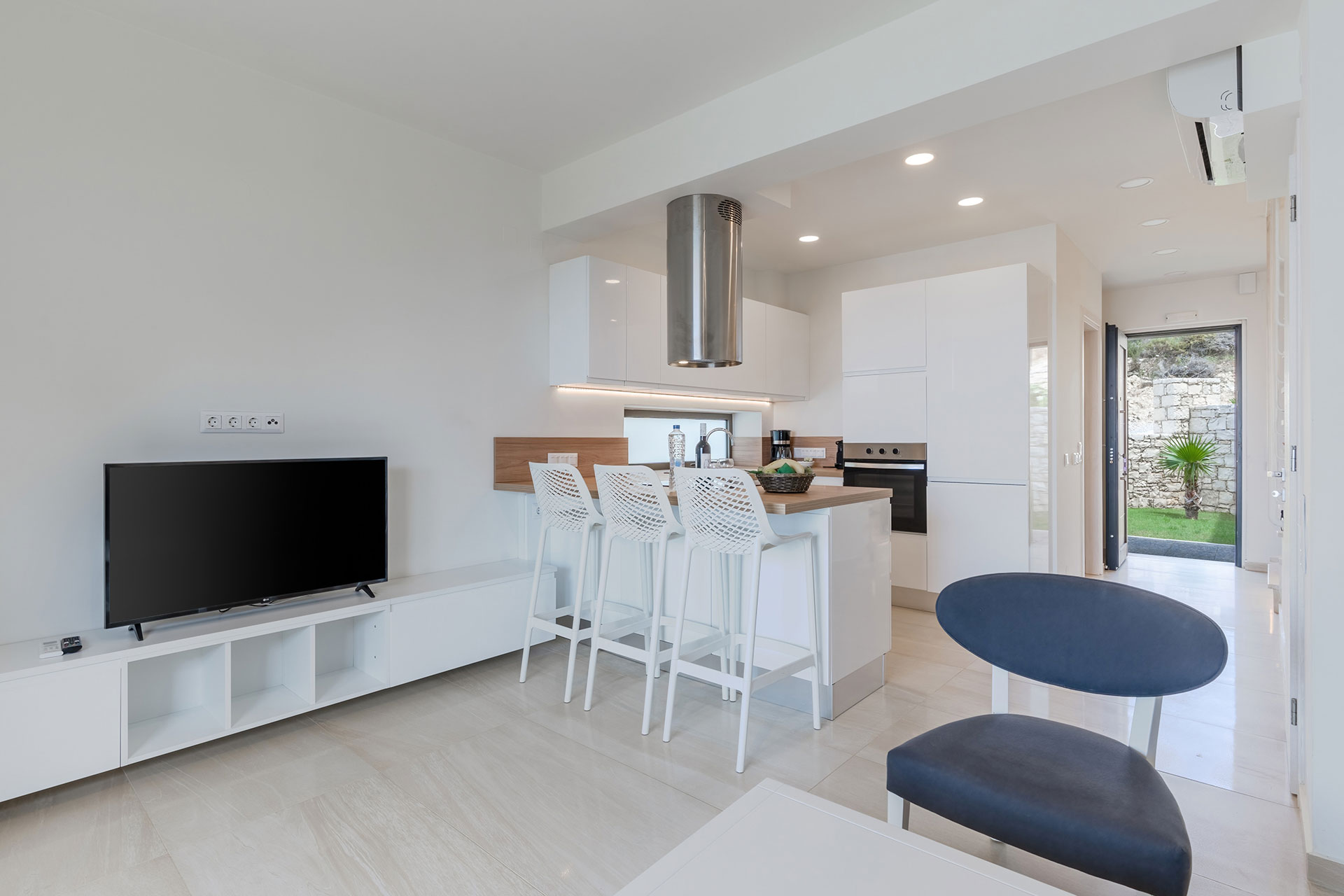 large area with white, modern kitchen and living room in a two bedrooms maisonette in plakias, rethymno, crete