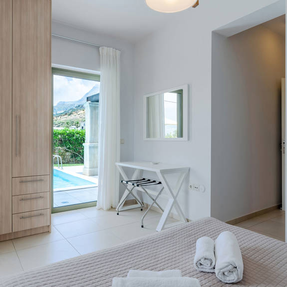 bedroom with double bed and big closet in a three bedrooms villa with pool and sea view in plakias, rethymno, crete