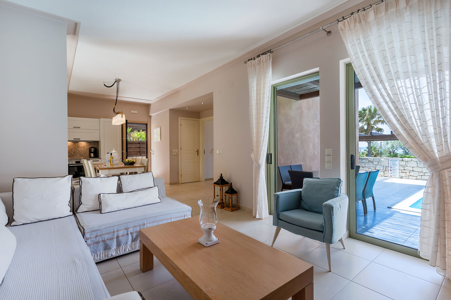 kitchen, living room and terrace in a three bedrooms villa with sea view in plakias, rethymno, crete