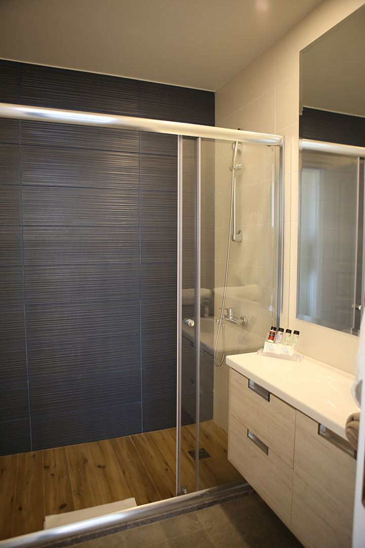 bathroom with large shower cabin in a two bedrooms superior apartment in plakias, rethymno, crete