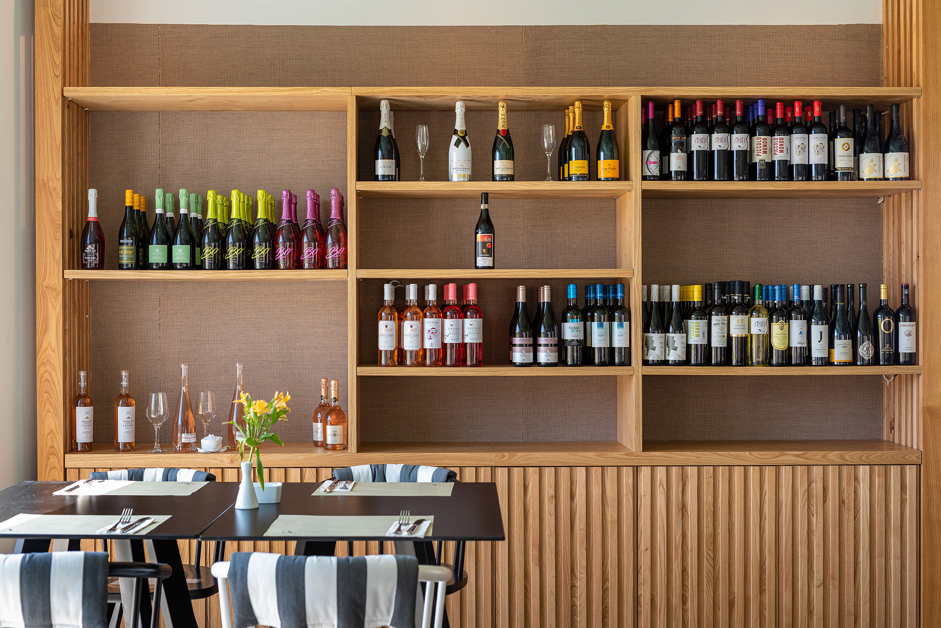 Plakias Resort Rethymno Main Restaurant indoor with bottles of local wine