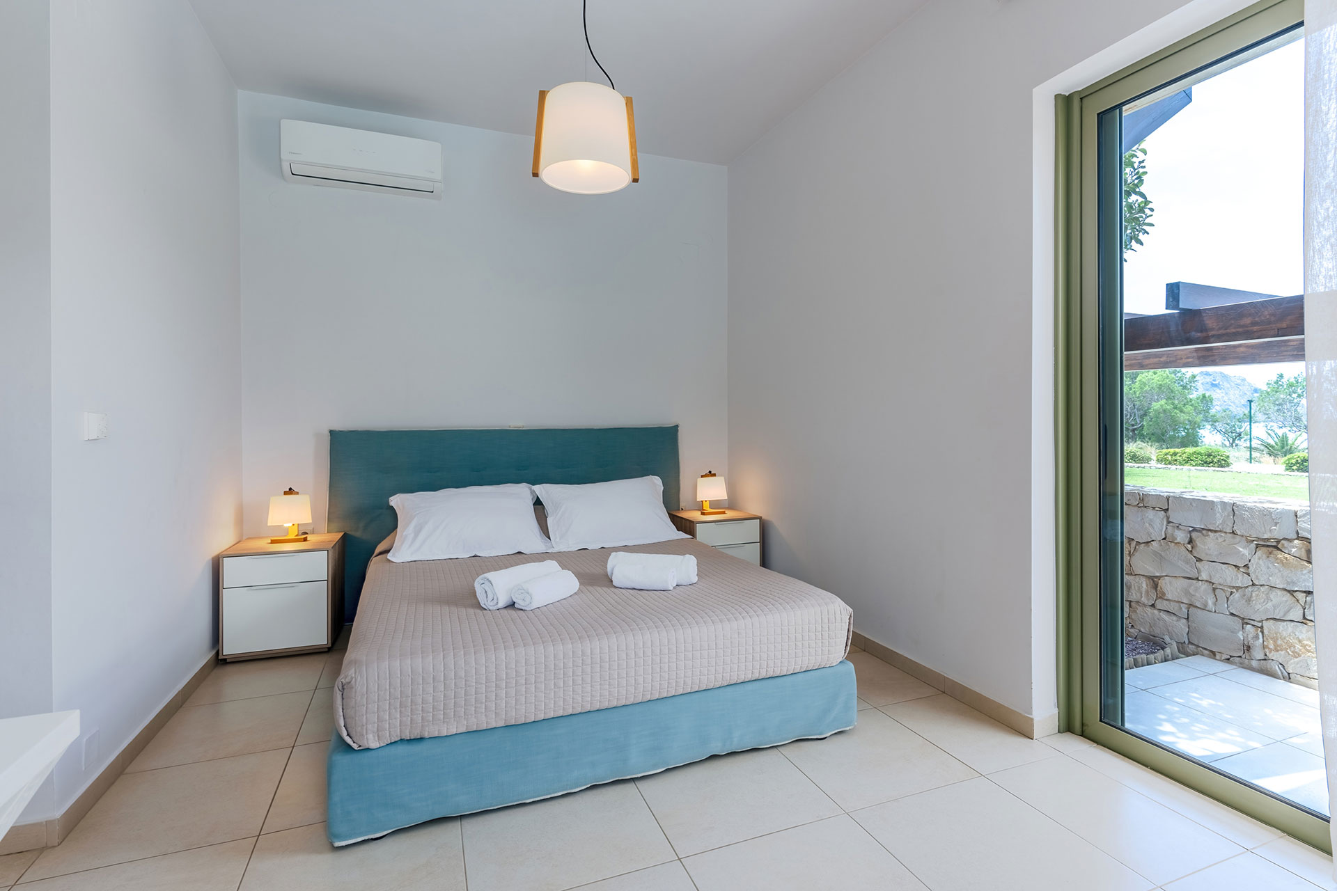 modern double bed bedroom with garden view in a three bedrooms villa with sea view in plakias, rethymno, crete