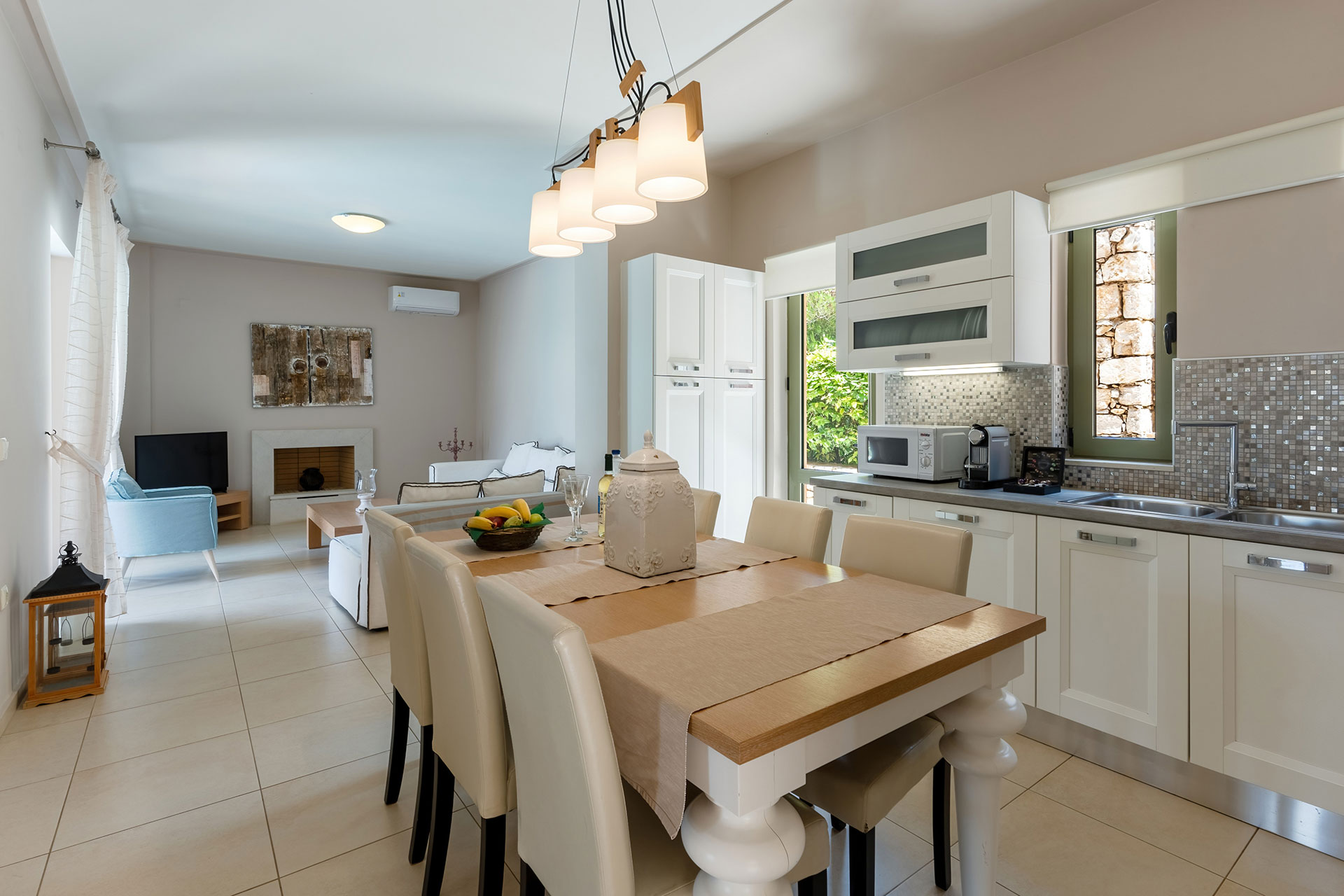 kitchen with big table and chairs in a three bedrooms villa with sea view in plakias, rethymno, crete