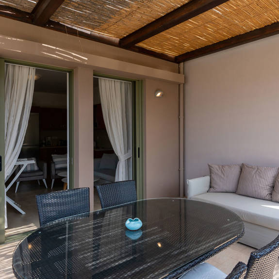 terrace with cane canopy and couch in a two bedrooms apartment in plakias, rethymno, crete