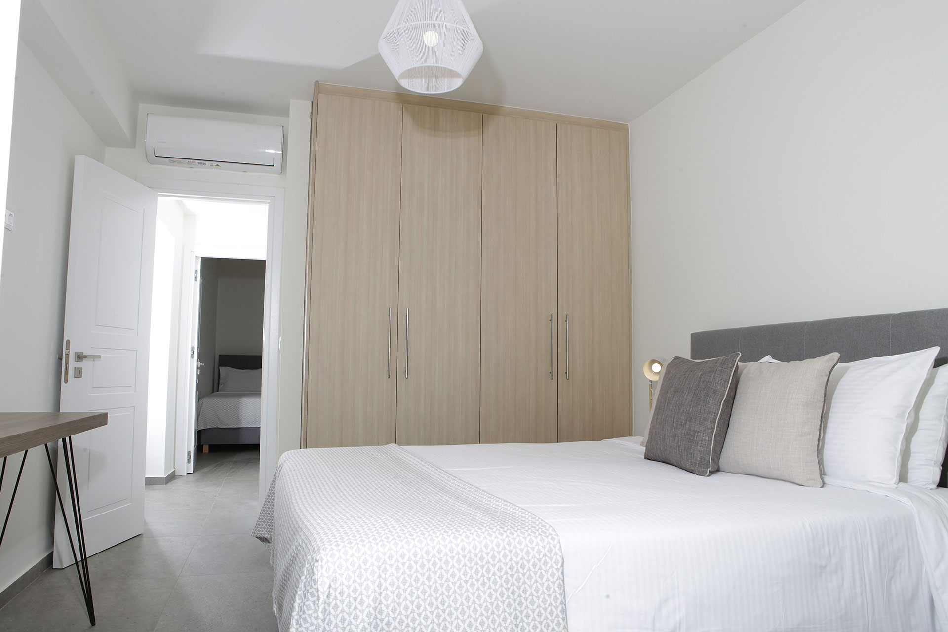 bedroom with double bed and closet in a two bedrooms superior apartment in plakias, rethymno, crete