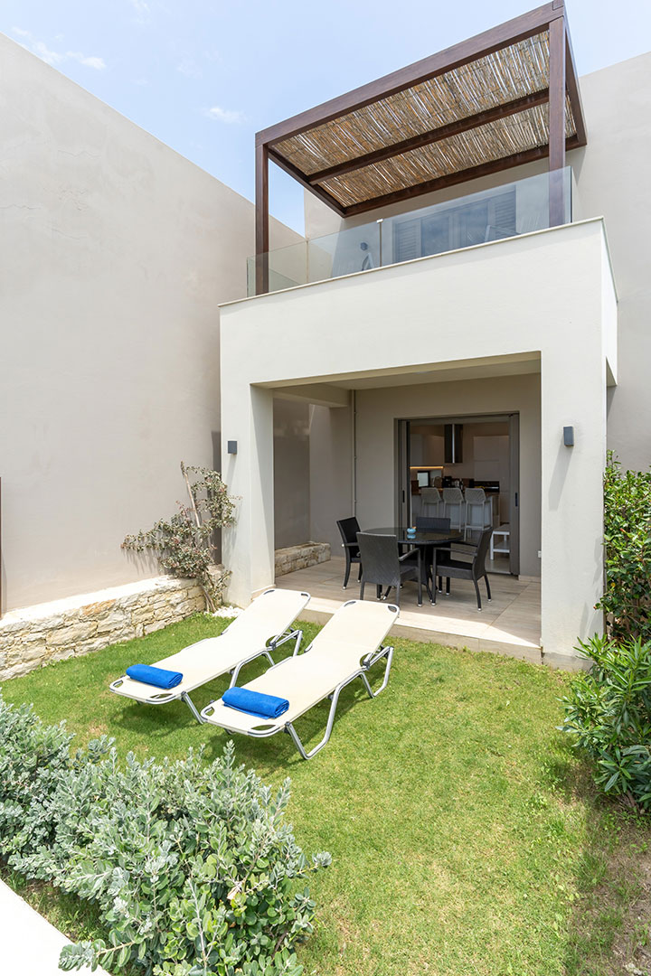 garden with lawn and sunbeds in a two bedrooms maisonette in plakias, rethymno, crete