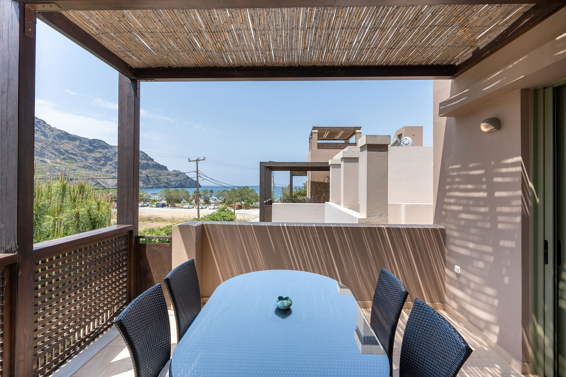 terrace with cane canopy and sea view in a two bedrooms apartment in plakias, rethymno, crete