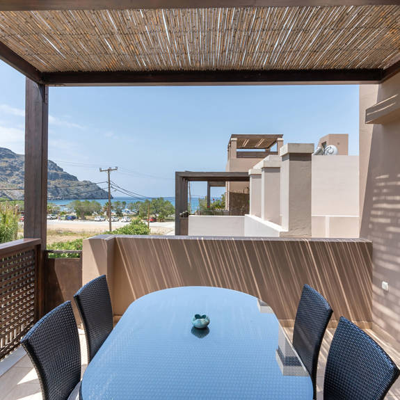 terrace with cane canopy and sea view in a two bedrooms apartment in plakias, rethymno, crete